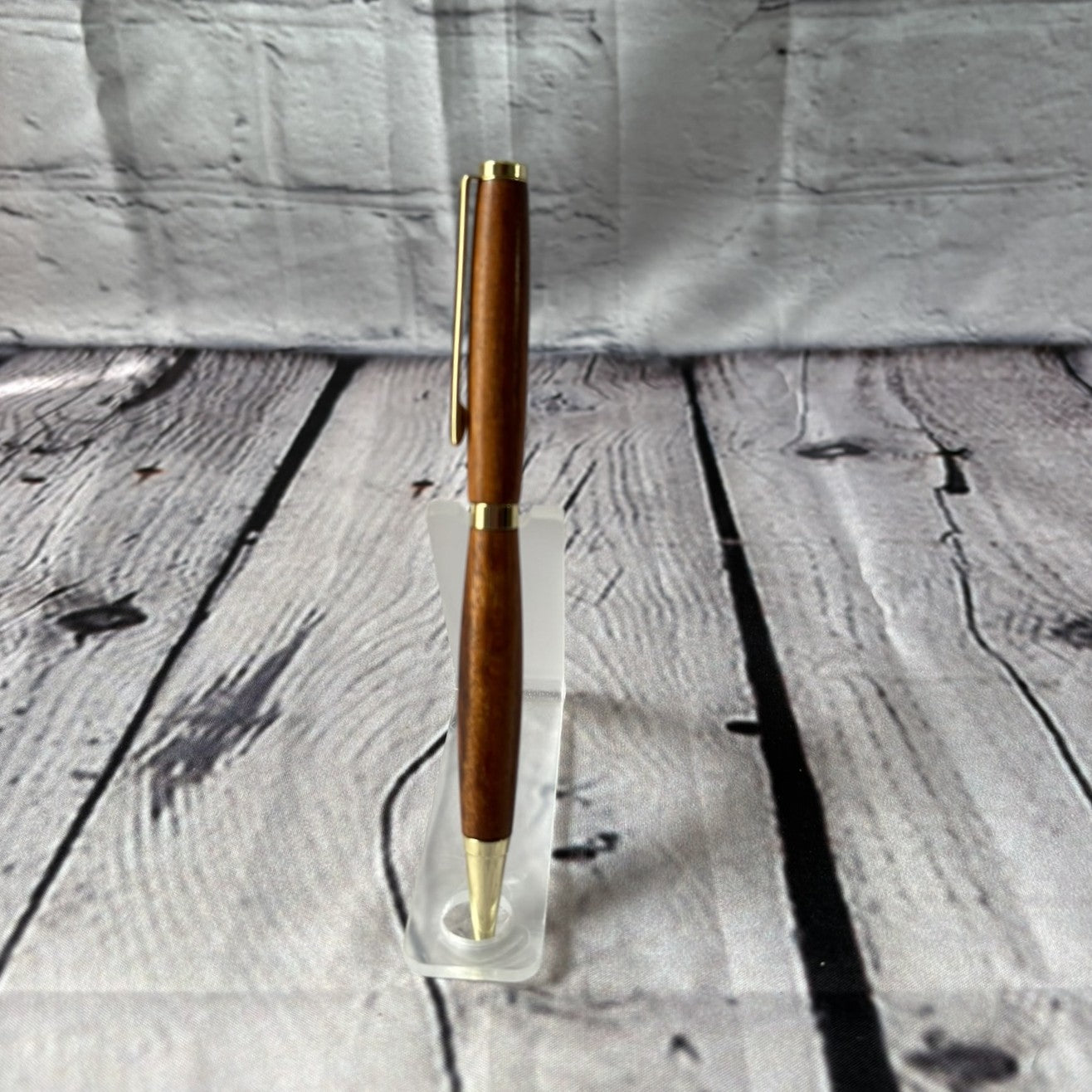 Slimline ballpoint pen with tigerwood and gold fittings