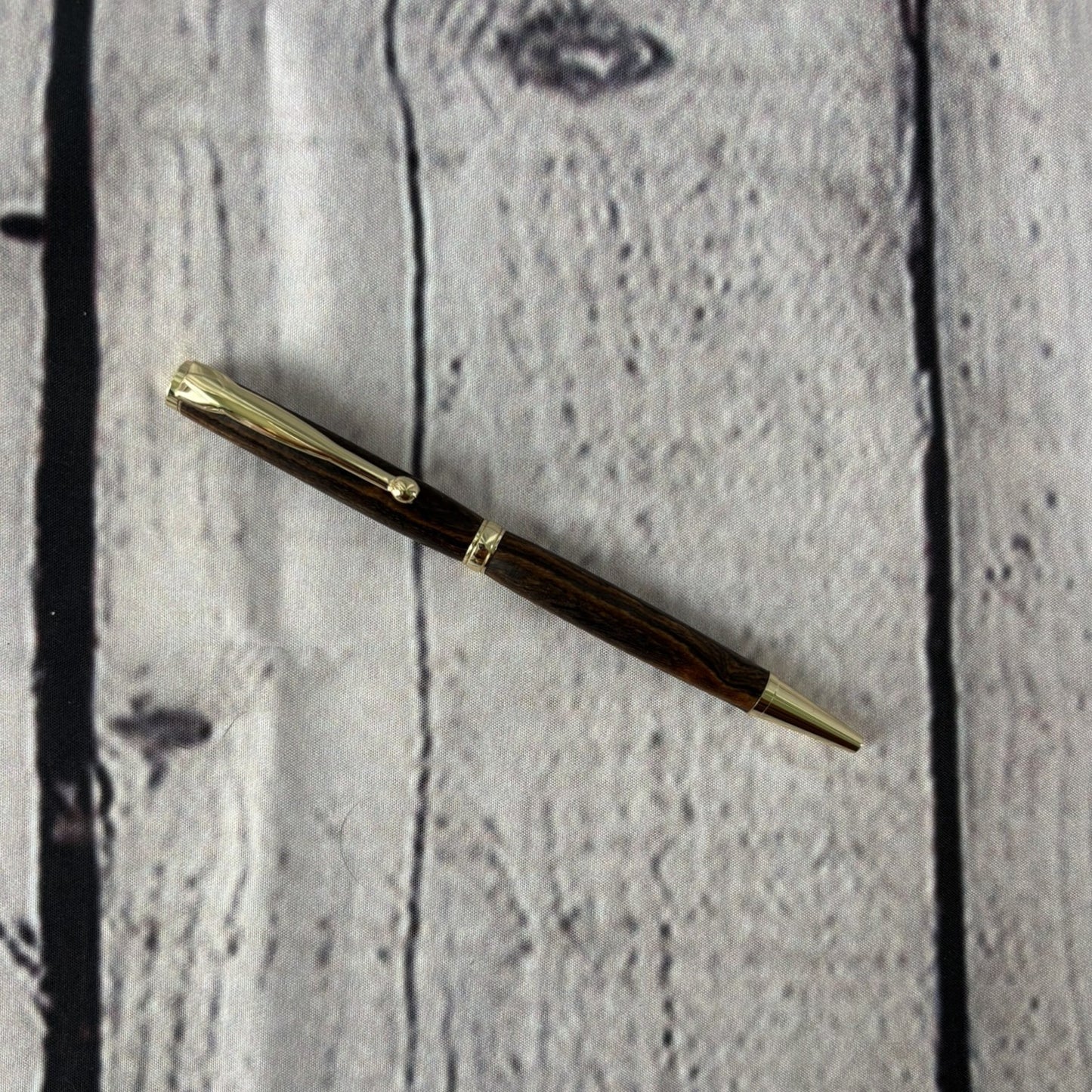 Slimline ballpoint pen with bocote wood and gold fittings