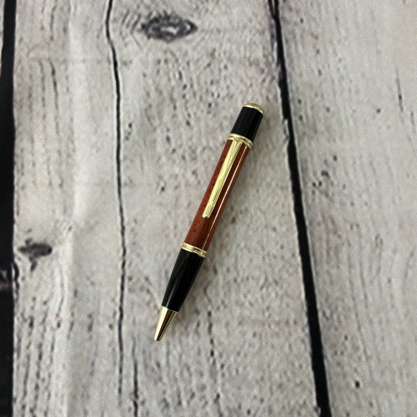 Gatsby Twist ballpoint pen with African padauk wood, black and gold fittings