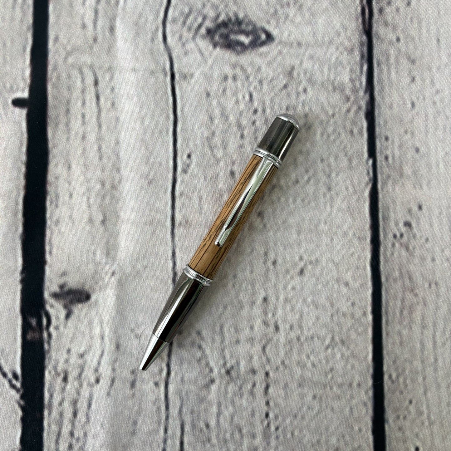 Gatsby Twist ballpoint pen with red oak, black and chrome fittings