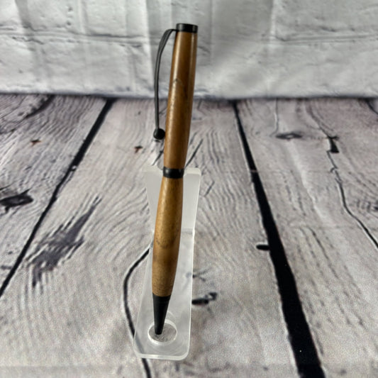 Slimline ballpoint pen with teakwood and black fittings