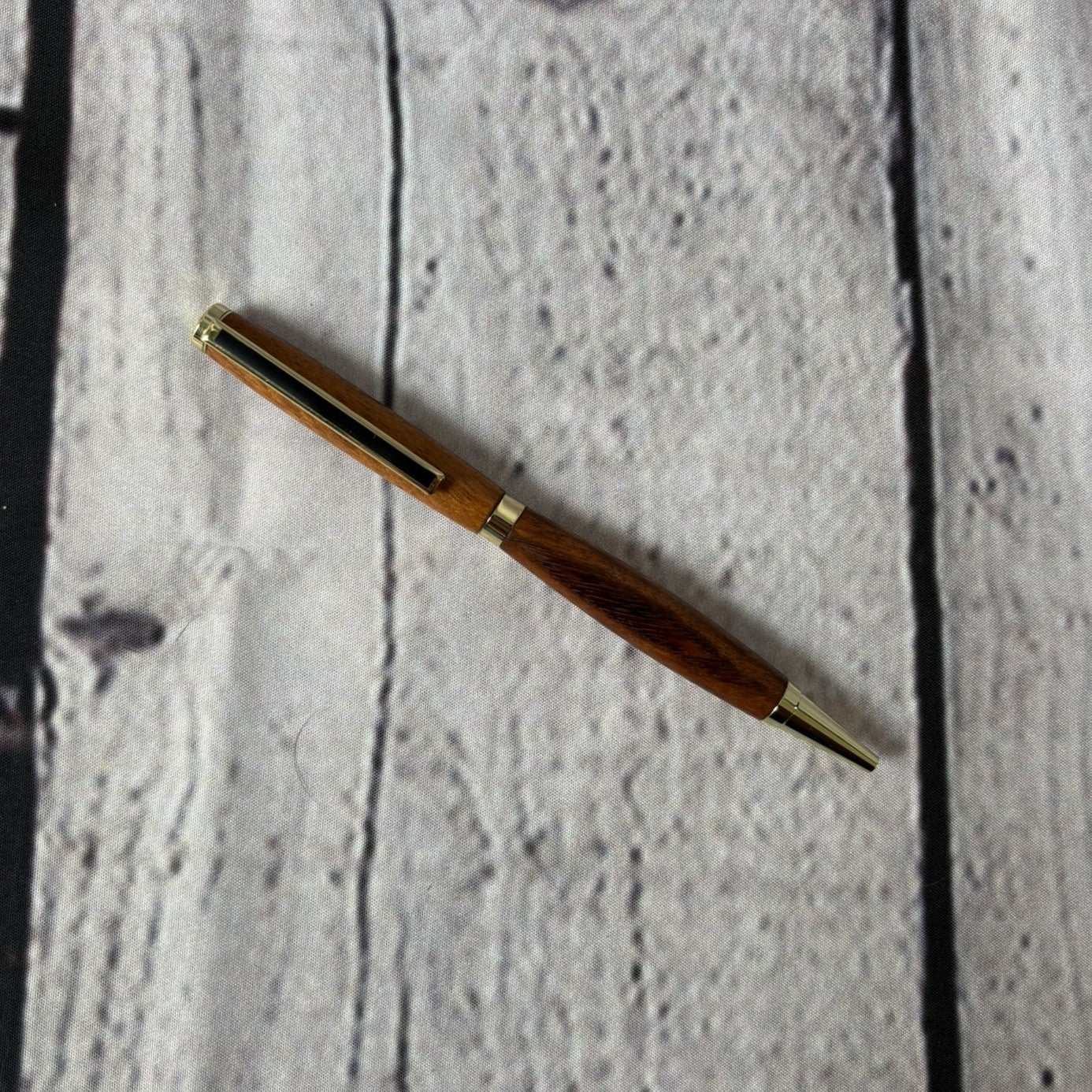 Slimline ballpoint pen with tigerwood and gold fittings