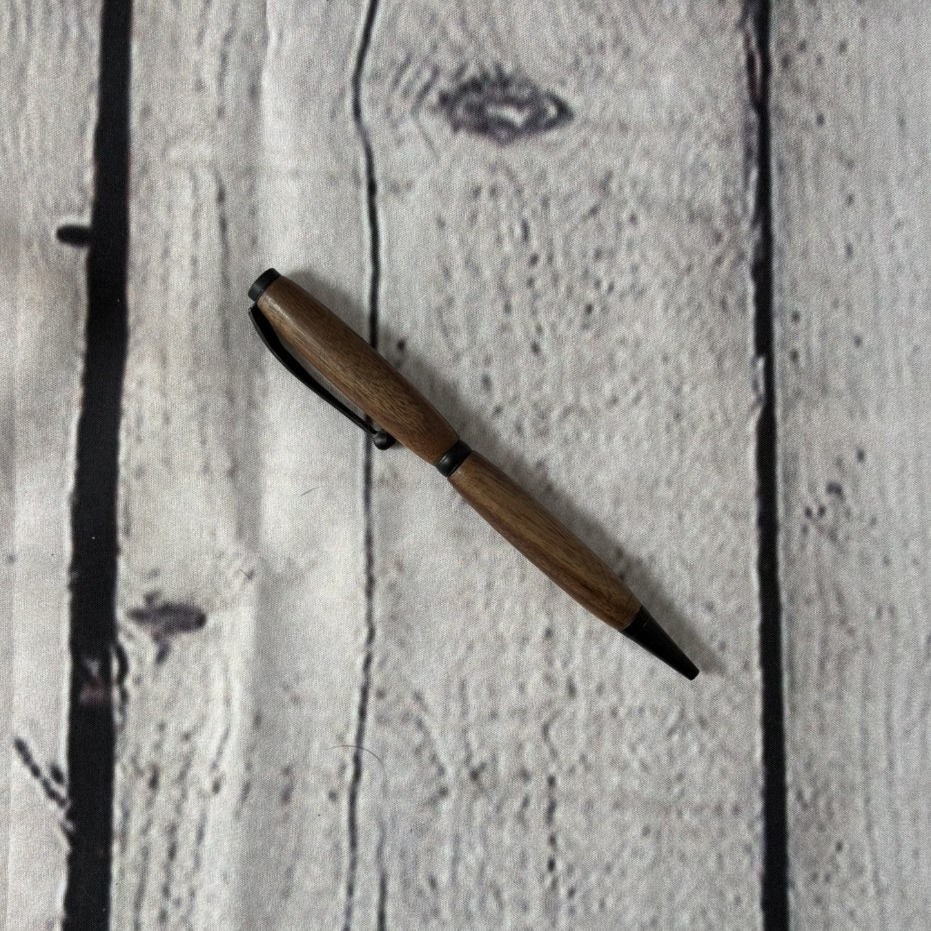 Slimline ballpoint pen with walnut and black fittings