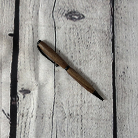 Slimline ballpoint pen with walnut and black fittings